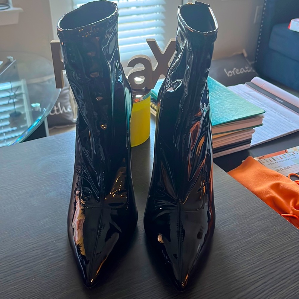 Black patent leather, Jennifer Lopez, high heel boots. Heel is about 5 inches